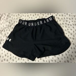 Small black under armor shorts.